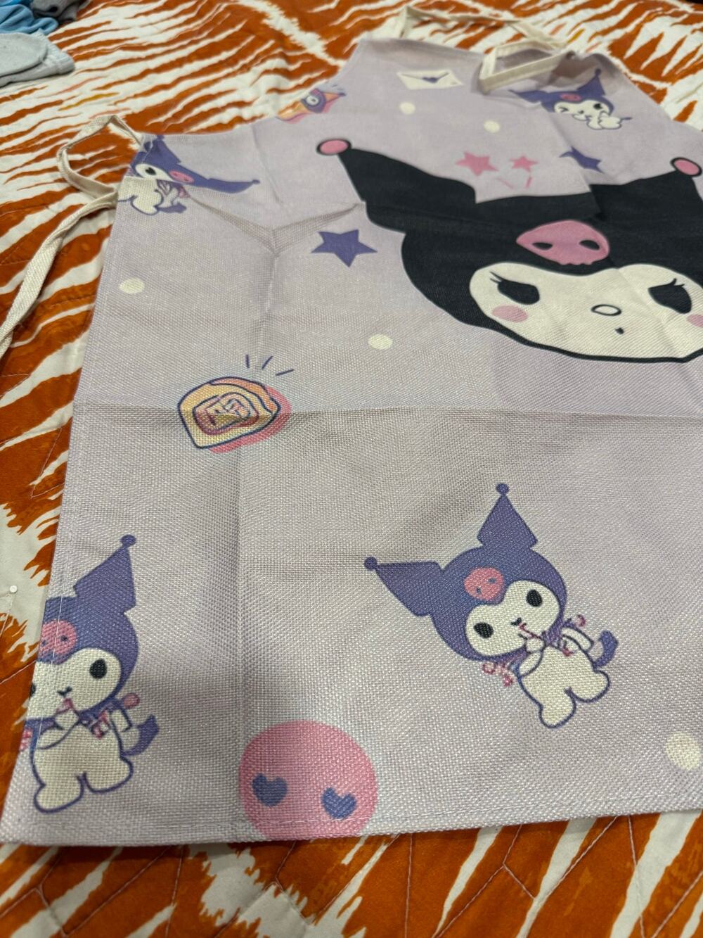 Kuromi apron repeating Kuromi characters and stars on light purple background